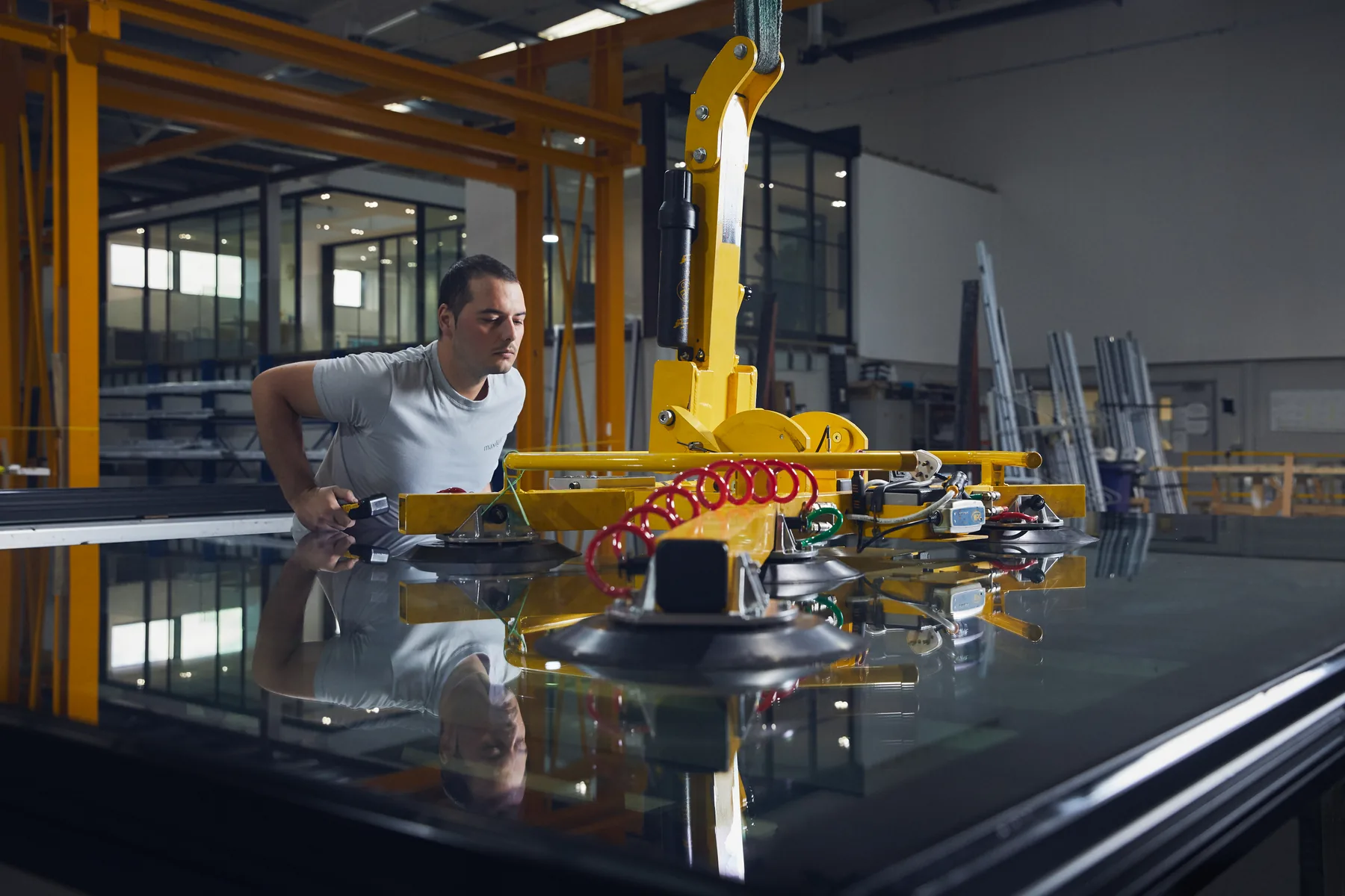 Maxlight installation team positioning architectural glass with specialist lifting equipment