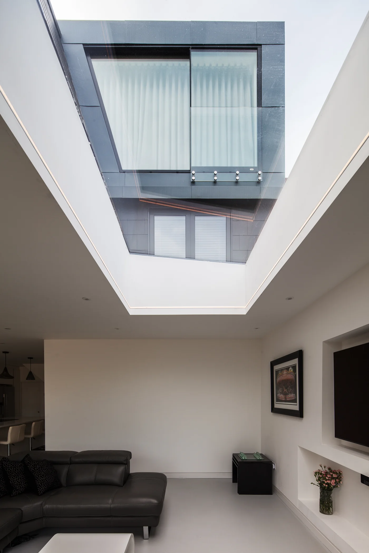 Skymax glazed rooflight opening viewed from the interior beneath the upper-storey window