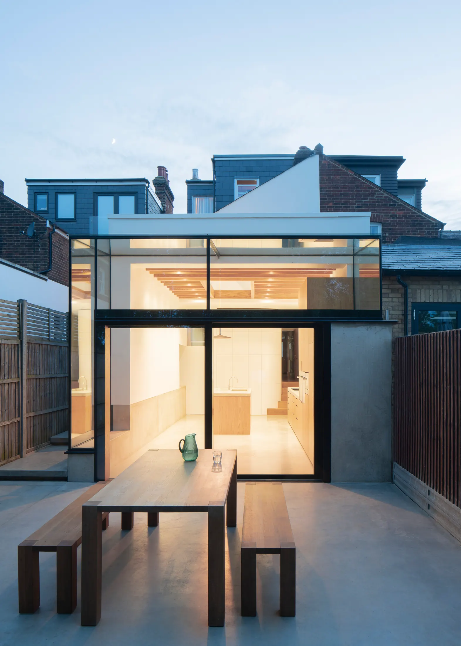 Maxlight frameless structural glazing — silicone-bonded glass box extension at twilight, ultra-slim 20 mm joints on a contemporary London residence